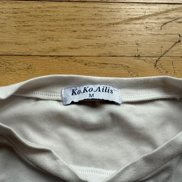 Koko Ailis white  Long-Sleeve Shirt With Vibrant Afrocentric Beaded Art Patch - Picture 6 of 6